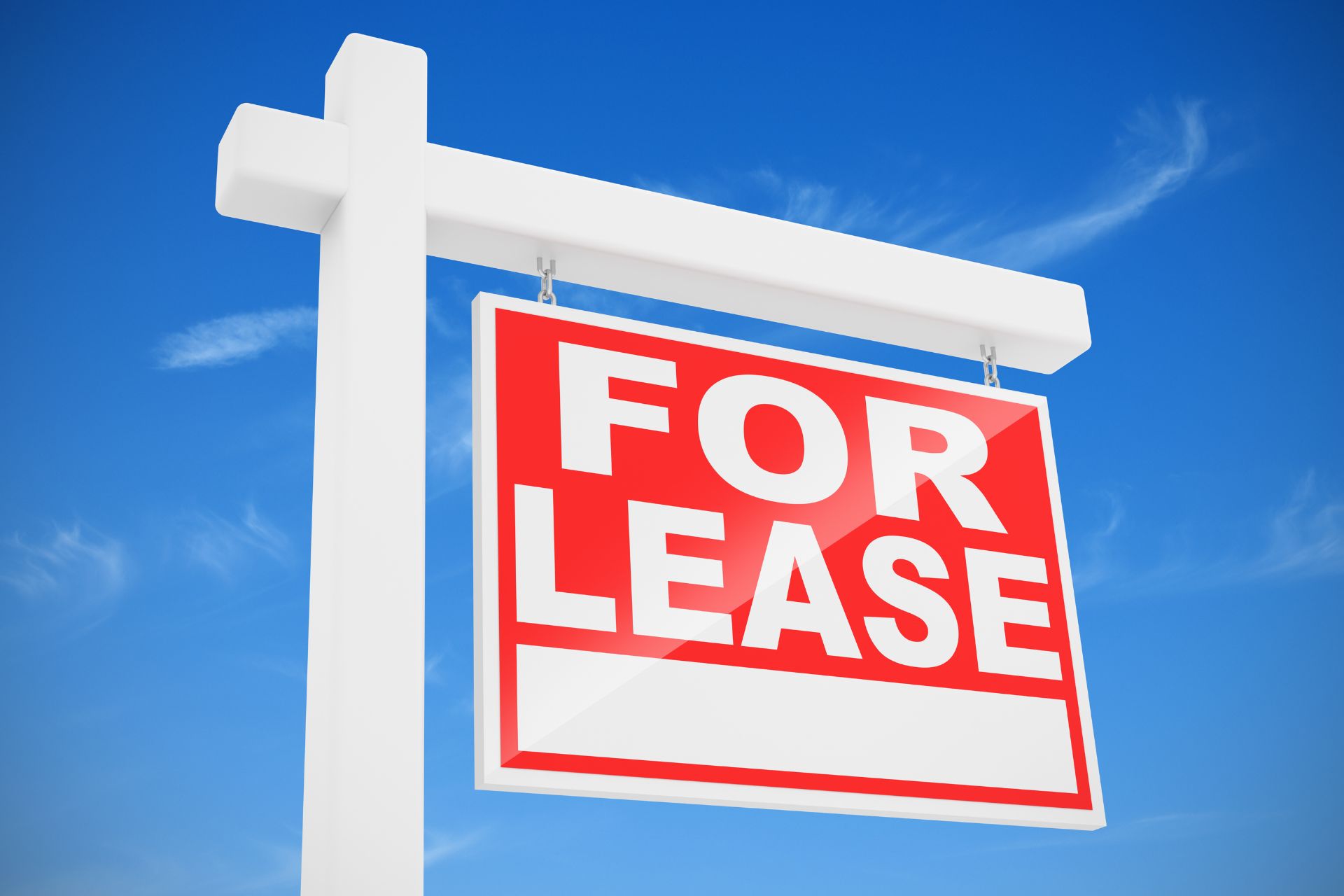 For Lease signboard under blue sky, representing a property available for rental and passive income real estate opportunities.