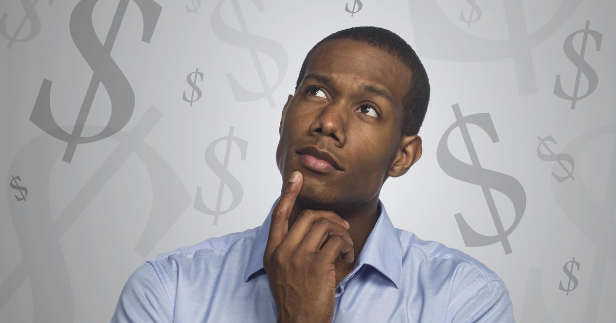 A person looking thoughtful while considering their finances and how to calculate a mortgage payment.