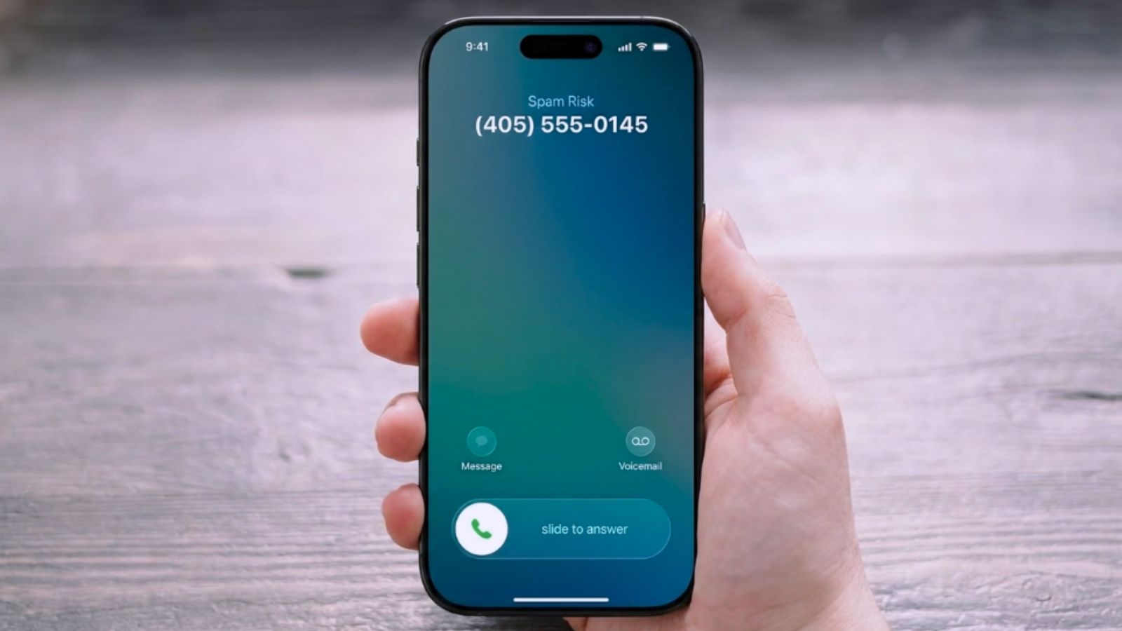 iPhone showing an incoming call flagged as Spam Risk